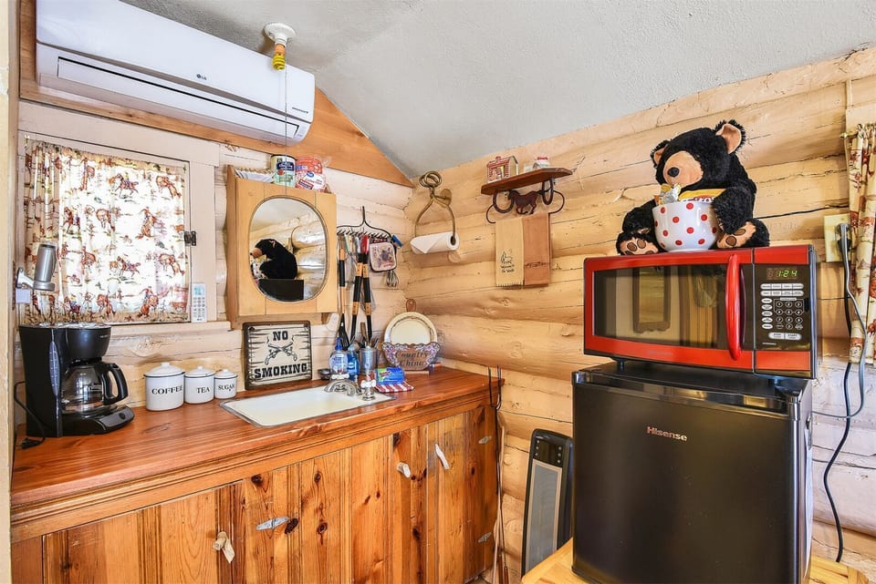 Roger`s Cabin - All the comforts of home in this cozy cabin, featuring a mini fridge, coffeemaker, and microwave for your convenience.