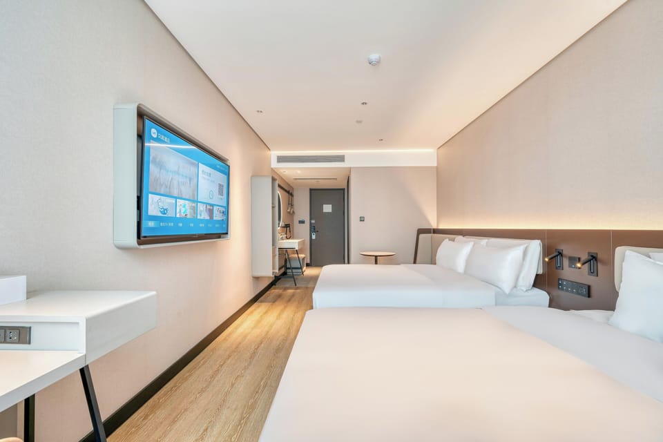 Premium bedding, desk, laptop workspace, blackout drapes