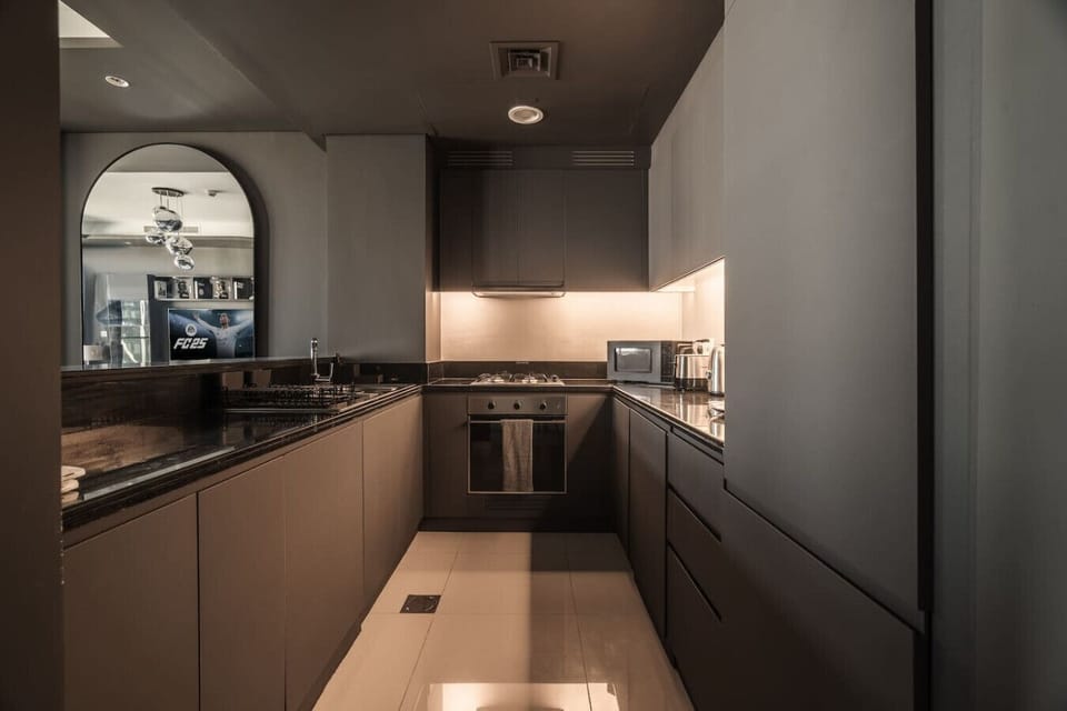 Elevate your dining experience in our gourmet kitchen, complete with luxury stainless steel appliances - stove, oven, fridge, washer, and dishwasher with essentials. Enjoy meals at a stylish table for six or al fresco dining on the sunlit balcony.
