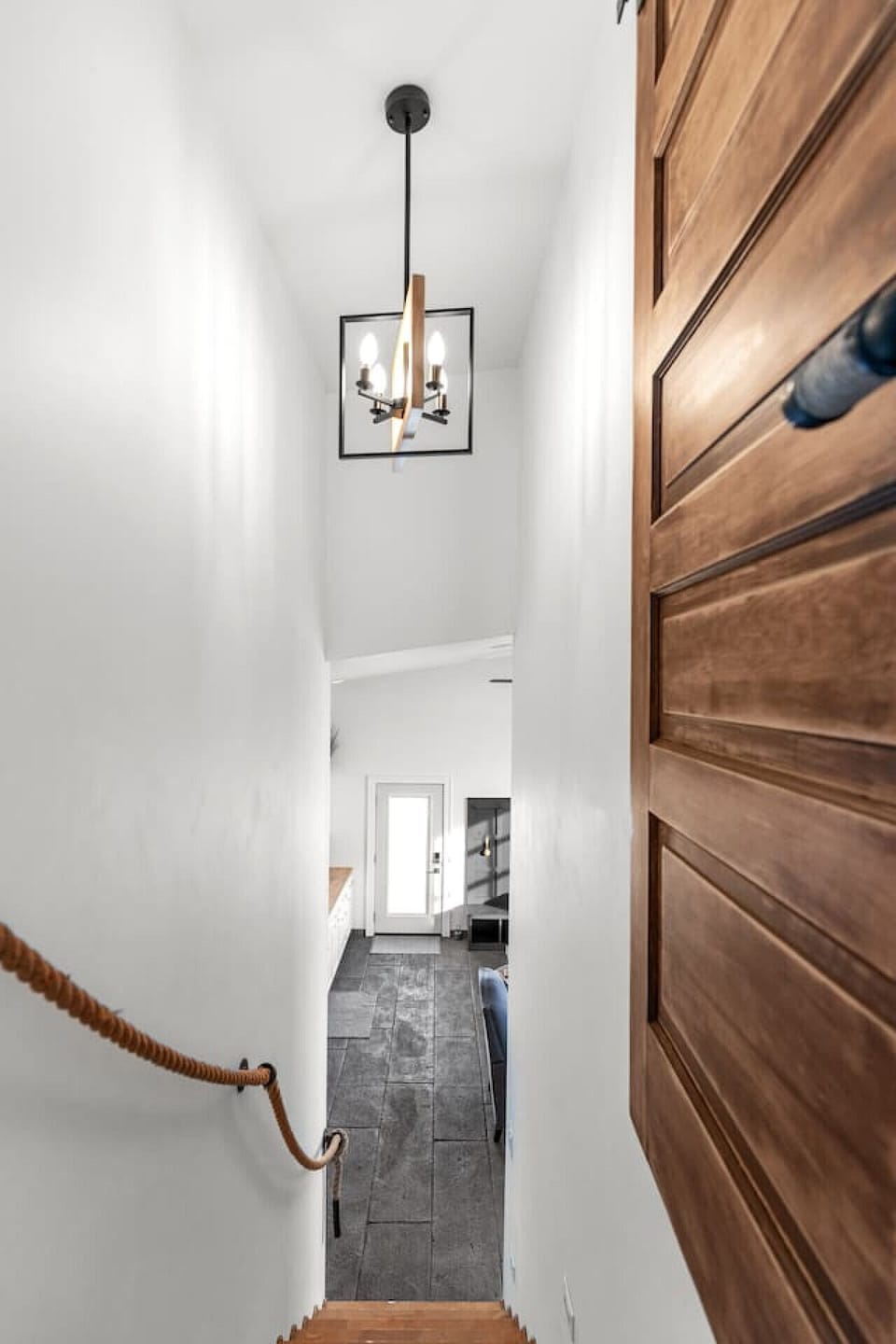 Modern ceiling lights illuminate your way upstairs to Bedroom #2.