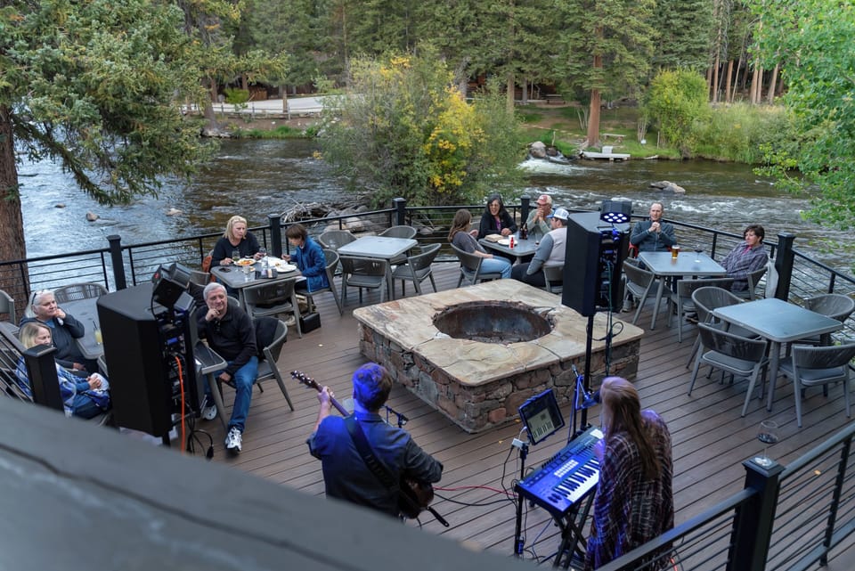 Gather by the riverside firepit for live evening music.