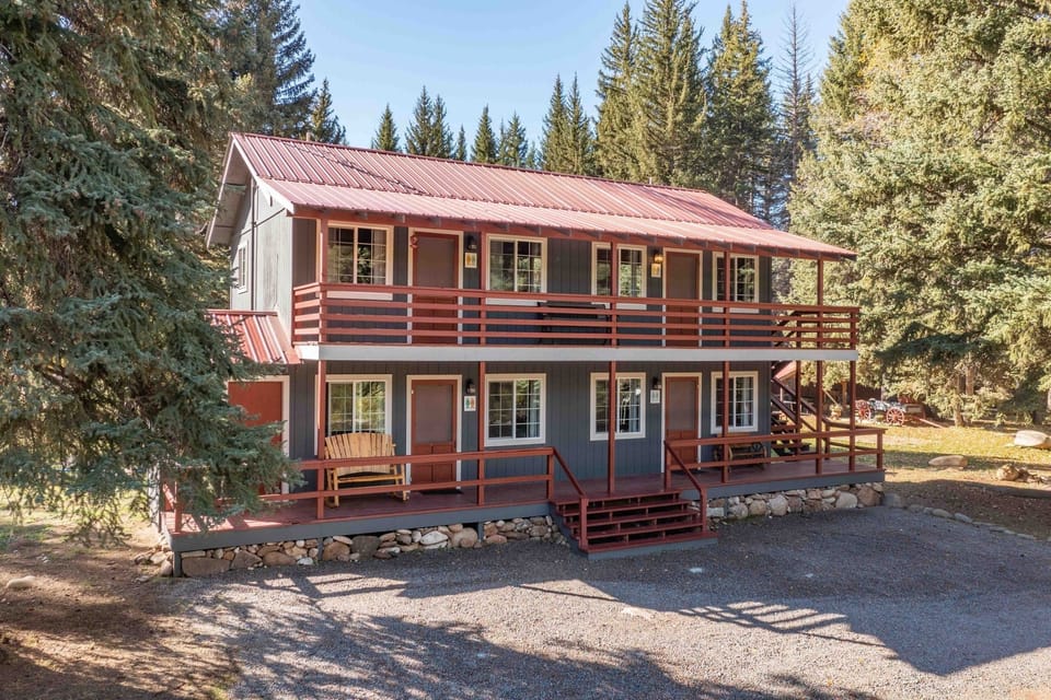 Enjoy a peaceful getaway with balconies and forest views.