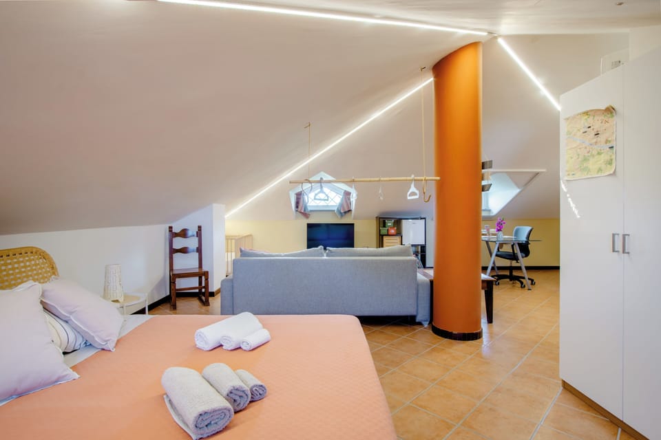 Deluxe Suite, Balcony | 1 bedroom, desk, laptop workspace, soundproofing