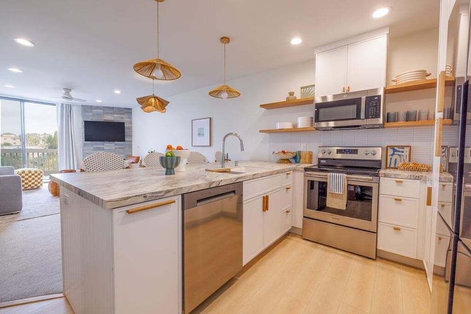 A beautiful updated kitchen with custom cabinetry and custom countertops