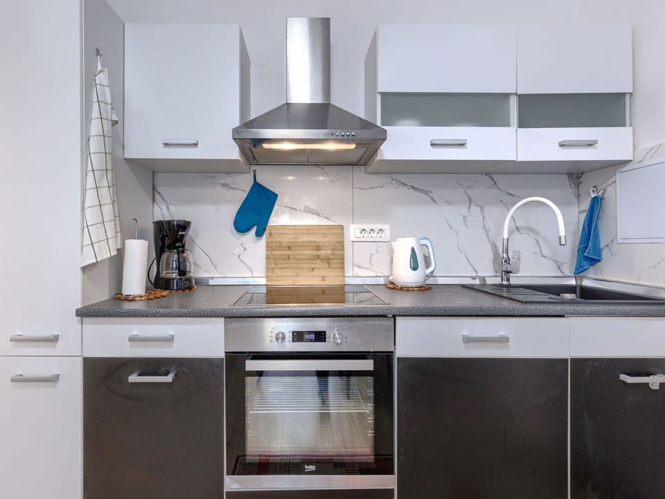 Kitchen Appliance, Kitchen, Countertop, Cabinetry, Major Appliance, Home Appliance, Interior Design, Kitchen Stove, Kitchen Sink, Furniture
