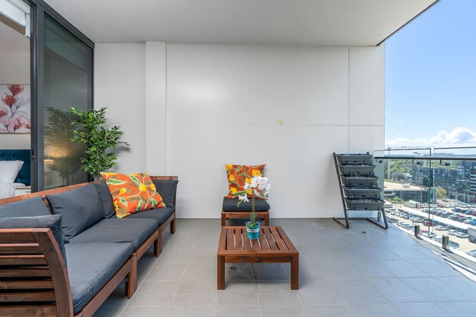 Balcony with table and sofa where you can sit, have your coffee, have some sunlight, and have some fresh air while appreciating the breathtaking view outside.