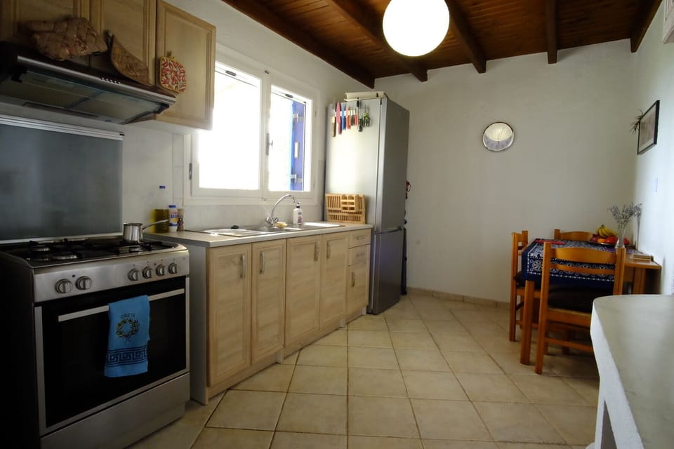 From the sitting room you walk into the kitchen.