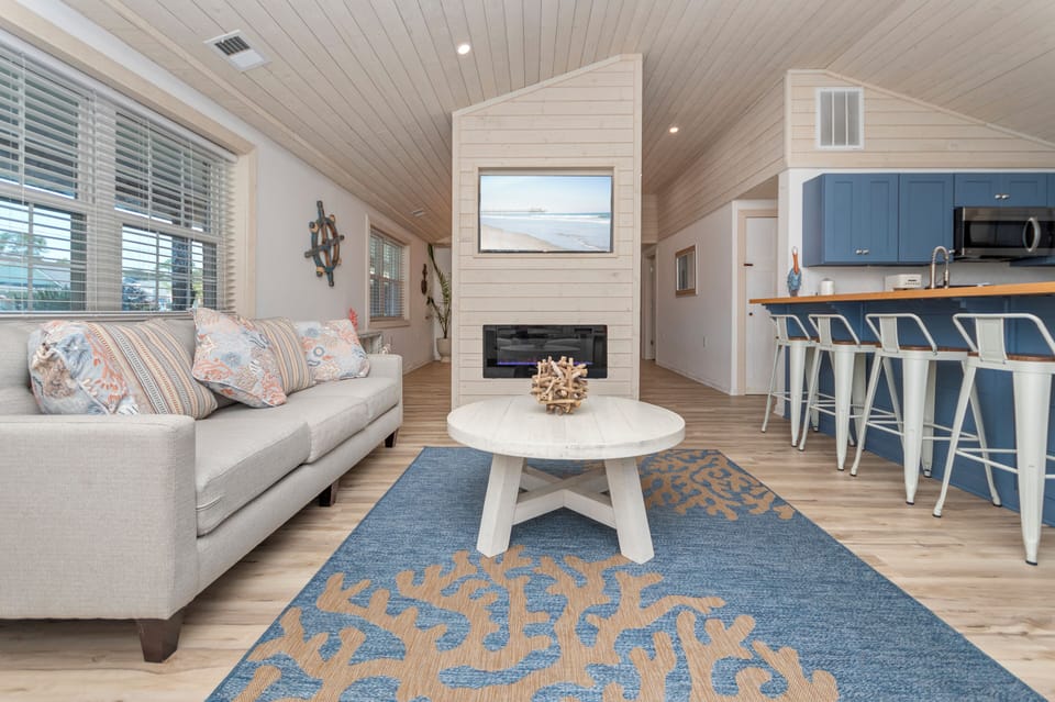 Living room with fireplace and TV