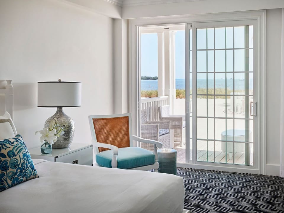 Bright and tranquil bedroom with ocean views and a private balcony for peaceful mornings.