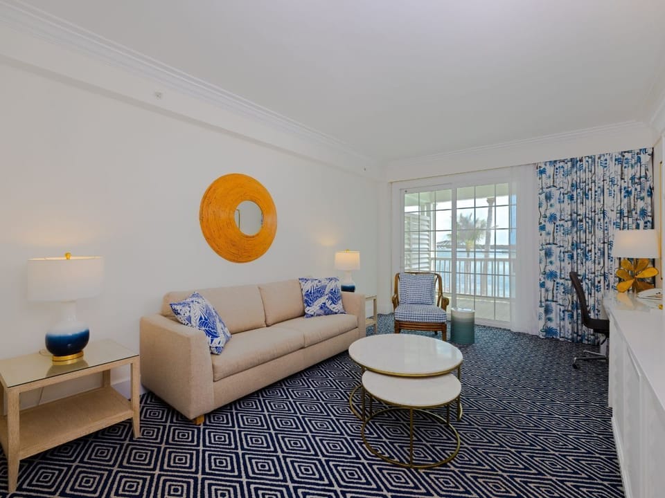 Inviting living area filled with natural light, plush seating, and chic decor for a relaxing escape.