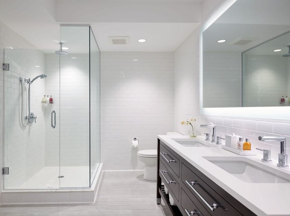 Elegant bathroom featuring a walk-in shower, sleek design, and calming ambiance for ultimate comfort.