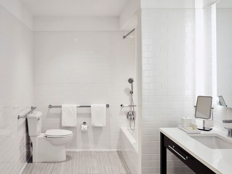 Modern bathroom with a clean, functional layout, offering a relaxing and accommodating space.
