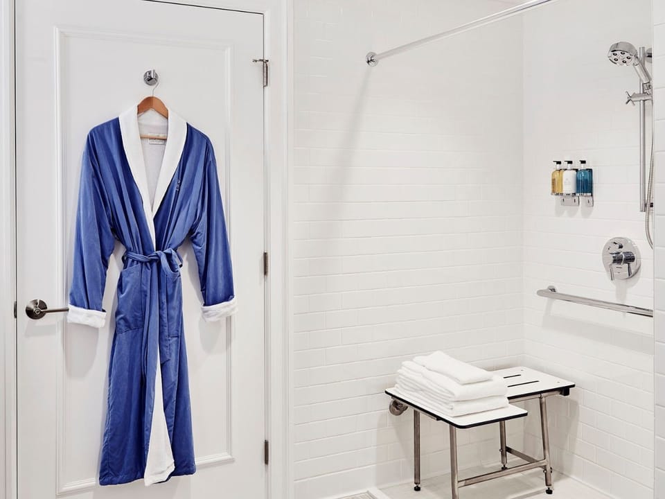 Accessible bathroom thoughtfully designed with a spacious shower and comfortable seating.