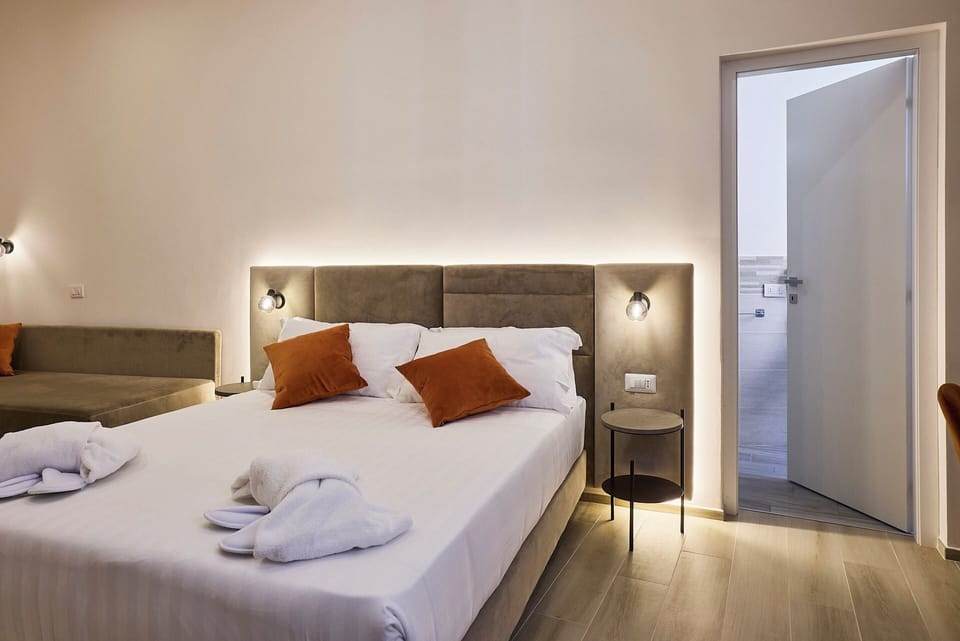 Deluxe Triple Room, Non Smoking, City View | In-room safe, desk, blackout drapes, soundproofing