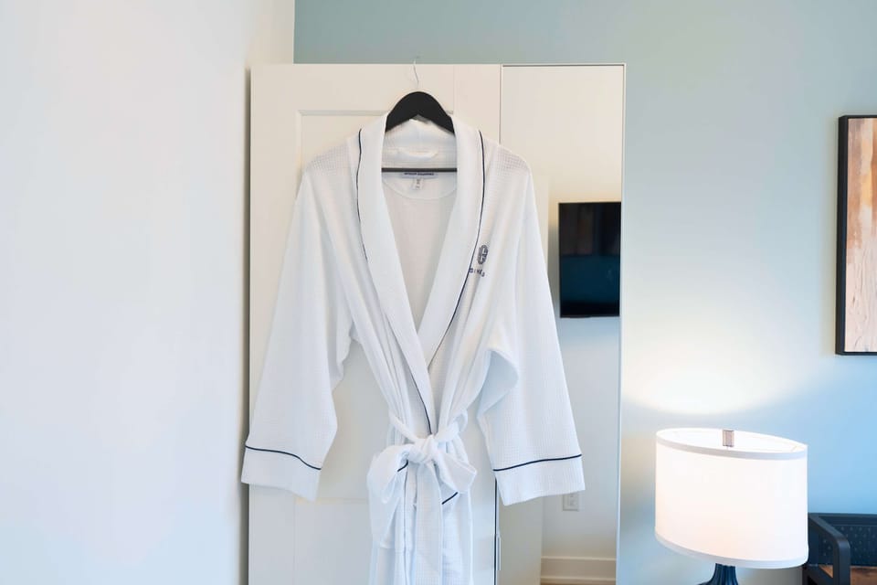 Thoughtful touches including a soft robe for added comfort.