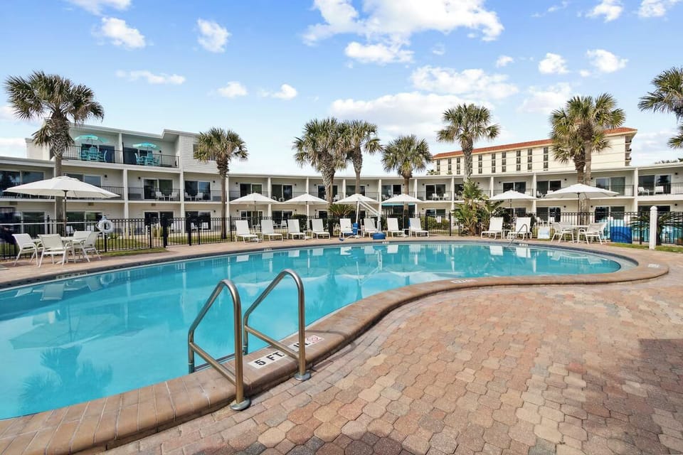 Relax poolside with roomy deck space and loungers.