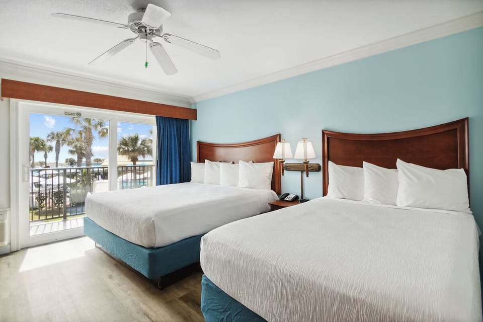 Drift off in a calm, coastal room with soothing hues.