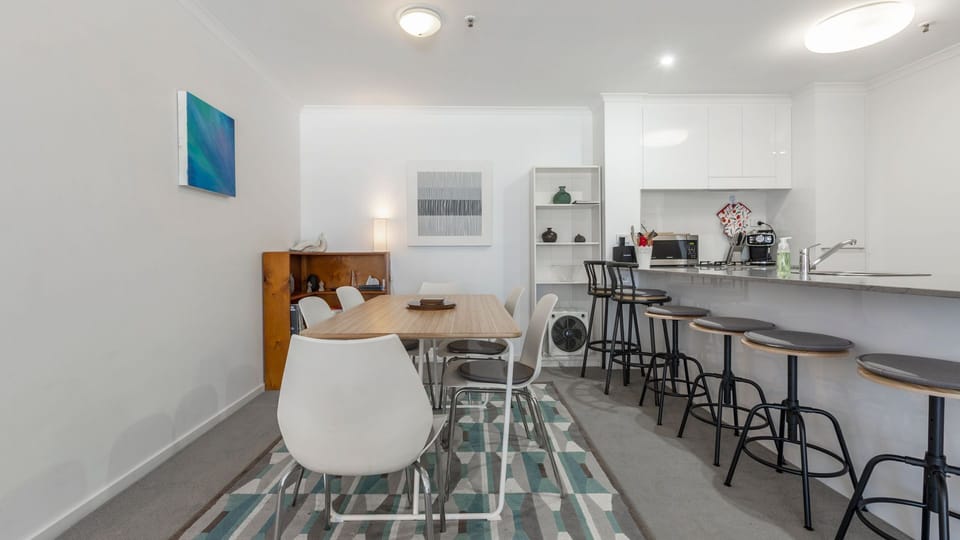 Dining area with seating positioned beside the kitchen for easy entertaining.