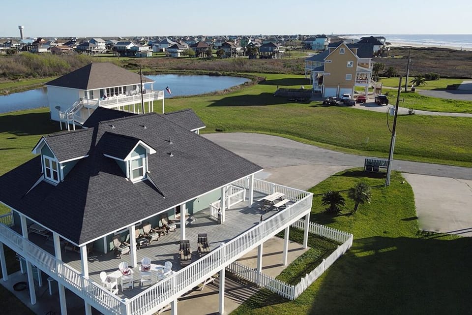 Spacious deck with ocean sunrise and pond sunset views