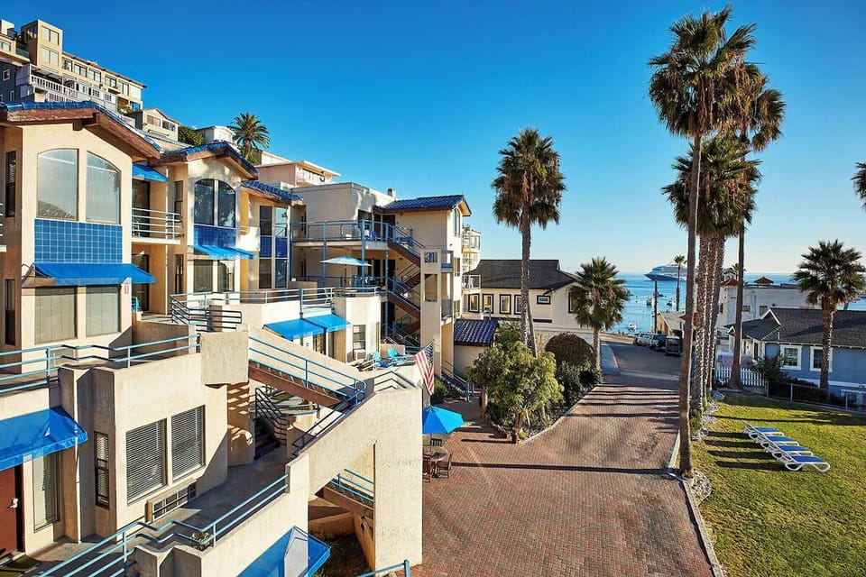 Arrive to sunlit seaside grounds just steps from water.