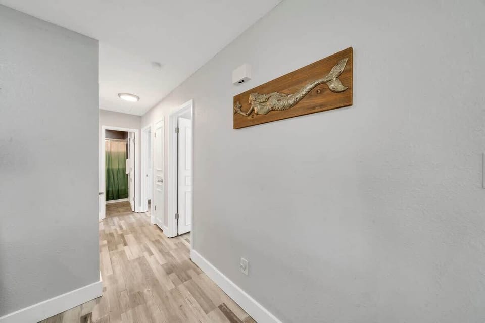 A charming coastal touch welcomes you down the hallway, where every detail reflects the beauty of the sea #SeasideVibes 