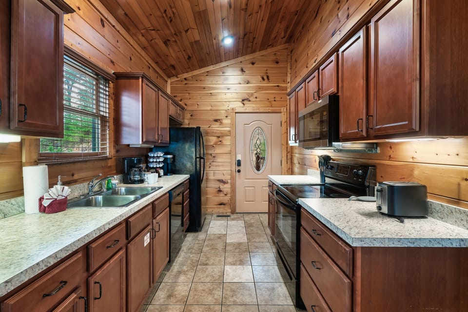 Cook and share meals in this full kitchen with a refrigerator with your friends and family!