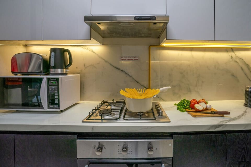 A modern, fully equipped kitchen designed for both functionality and style.