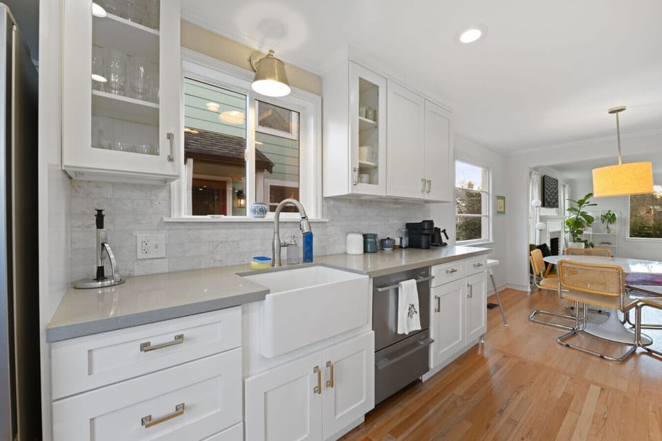 Enjoy a modern farmhouse sink, stainless steel appliances, and a well-stocked coffee station.
