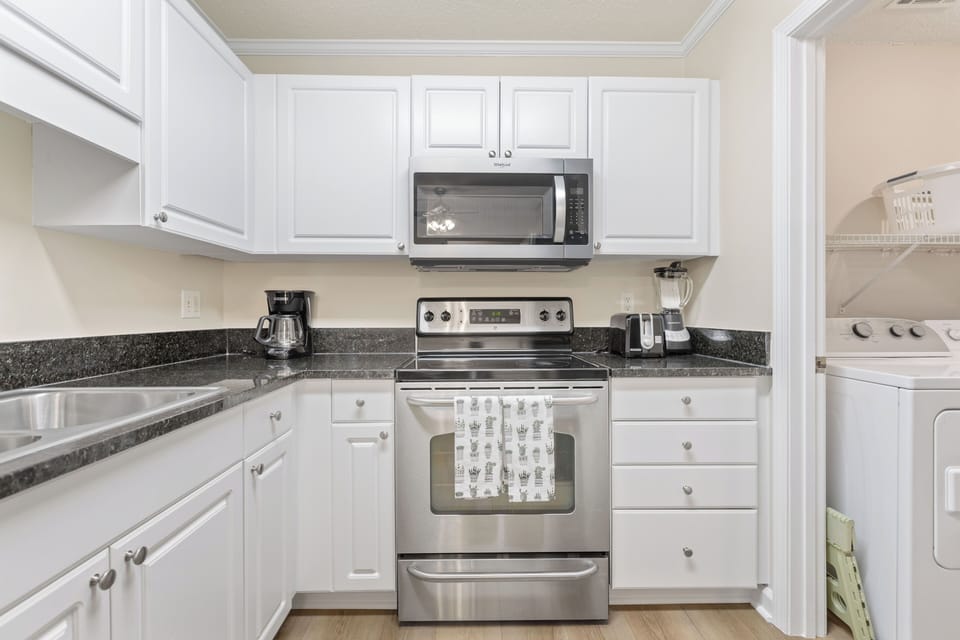 Sleek, stylish, and modern kitchen equipped for your culinary adventures