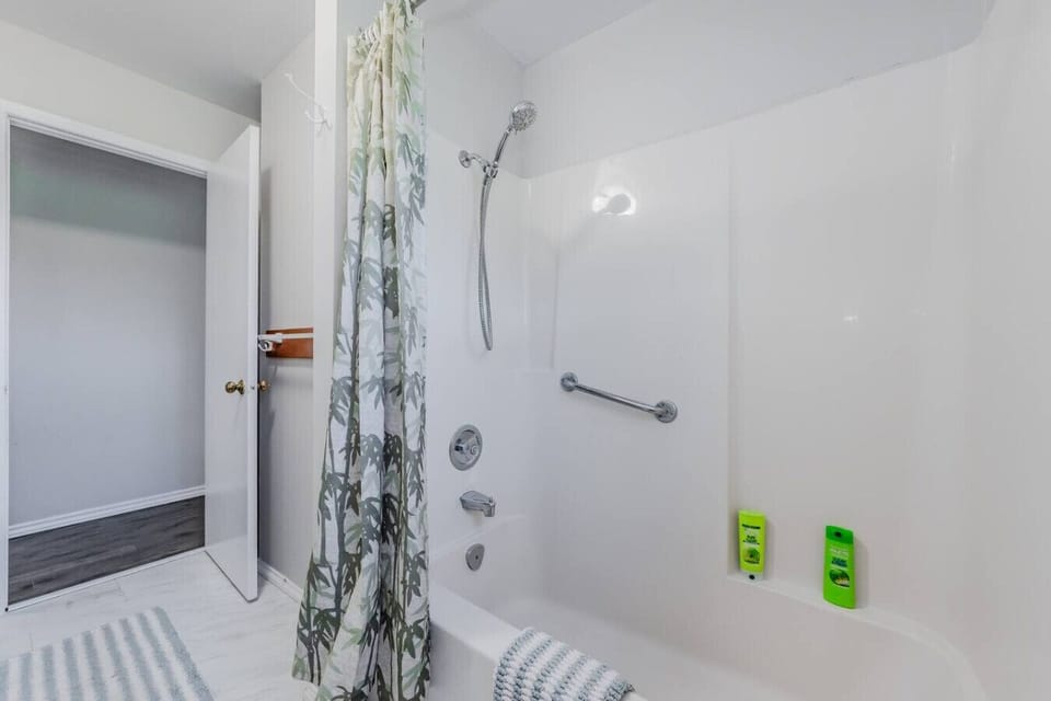 The bathroom`s shower area is designed for comfort and convenience, offering a refreshing start to your day.