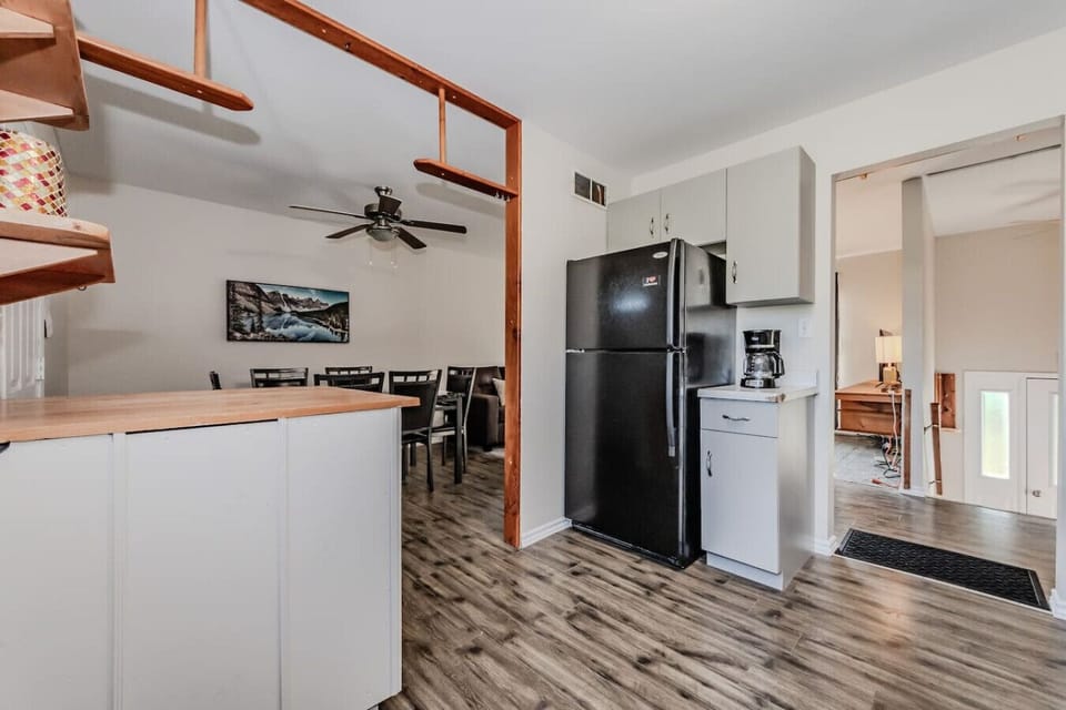 The kitchen’s well-appointed layout includes a full-size refrigerator and coffee maker, ensuring all your culinary needs are attended to during your stay.