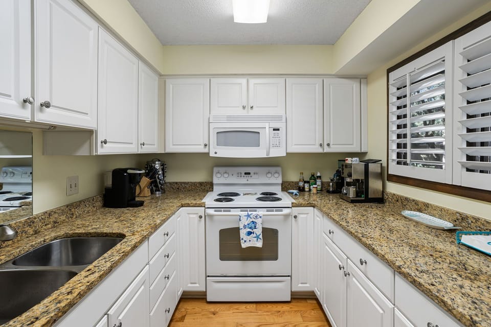 A well-stocked kitchen with abundant counterspace makes meal prep a joy.