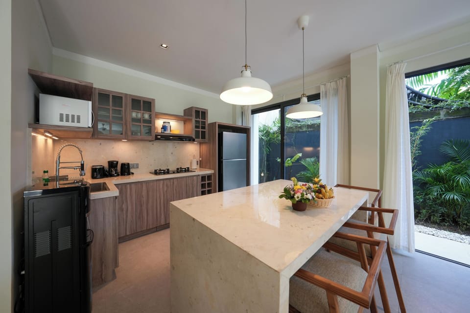 Deluxe Villa, Balcony, Pool View | Private kitchen | Coffee/tea maker