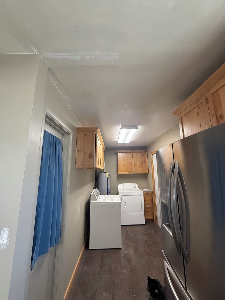 Washer and dryer area off kitchen. Door to backyard. 