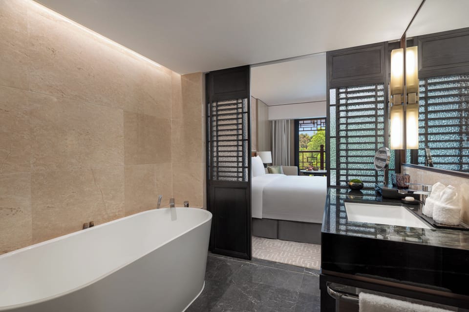 Basic Single Room, Balcony, Park View | Bathroom | Separate tub and shower, hair dryer, slippers, towels