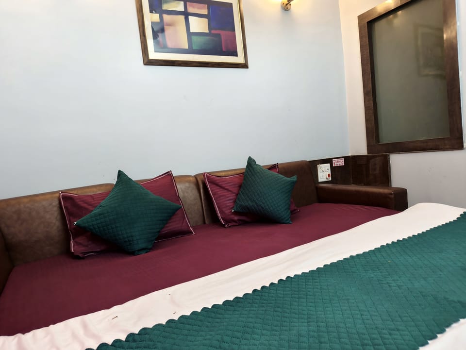 AC Deluxe Triple Bedroom With City View | Premium bedding, down comforters, memory foam beds, desk