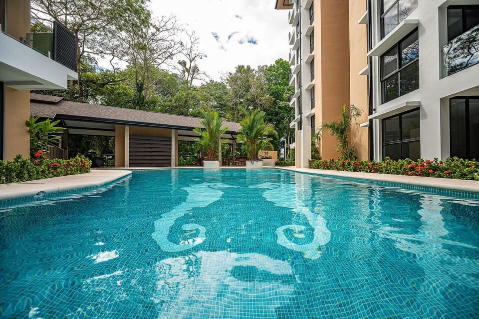 Pool area at Torres del Mar condominiums with one large pool and a smaller children's pool