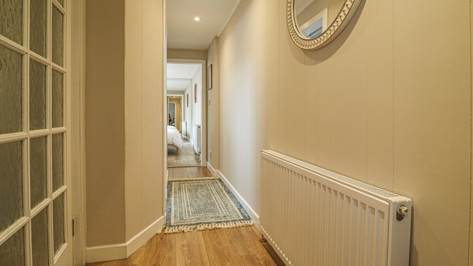 Located just outside the bedroom, this walkway provides easy access to the property's outdoor spaces.