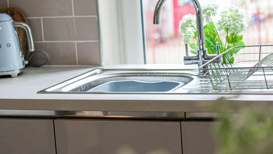 A clean and well-maintained kitchen sink designed for everyday convenience, making cooking and clean-up easy and stress-free during your stay.