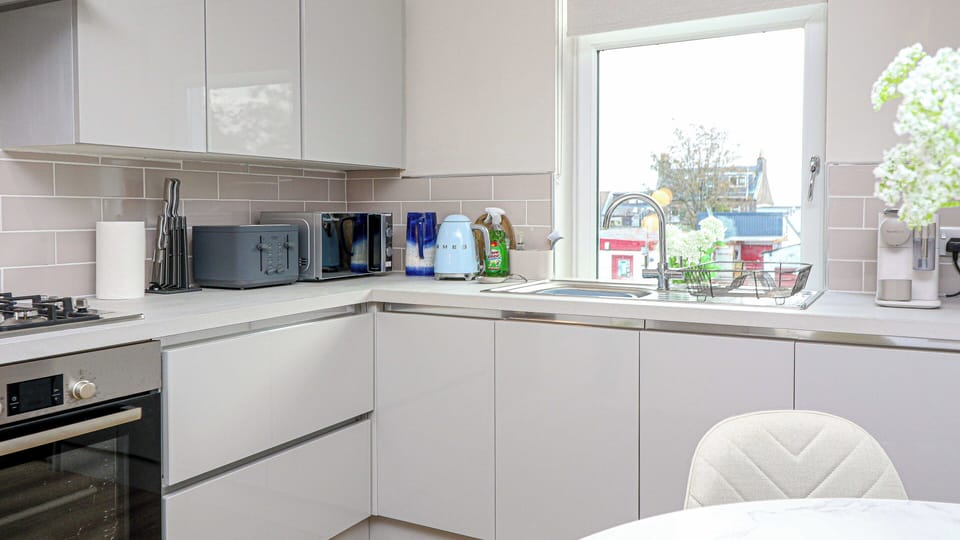 A bright and functional kitchen space that’s perfect for cooking, dining, and everyday use.