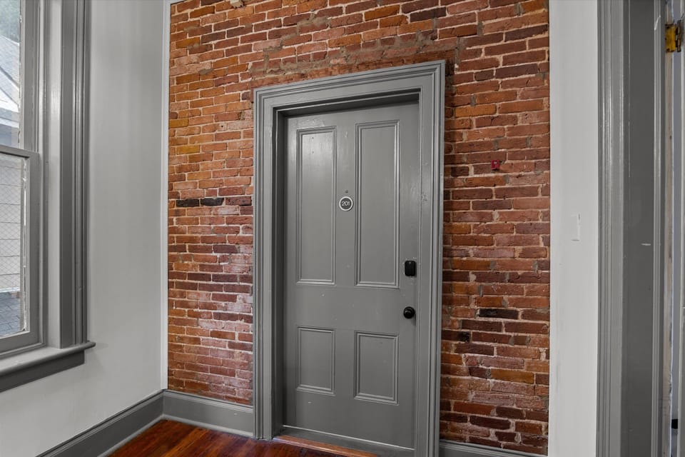 Door to unit, punch in personalized code into smartlock for entry 