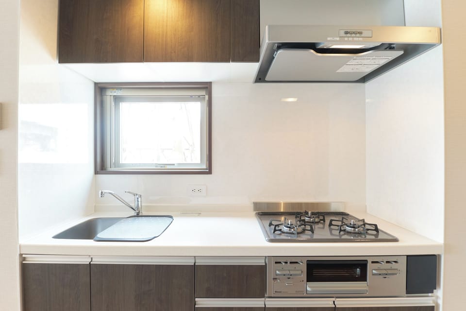 Apartment | Private kitchen | Fridge, microwave, stovetop, cookware/dishes/utensils