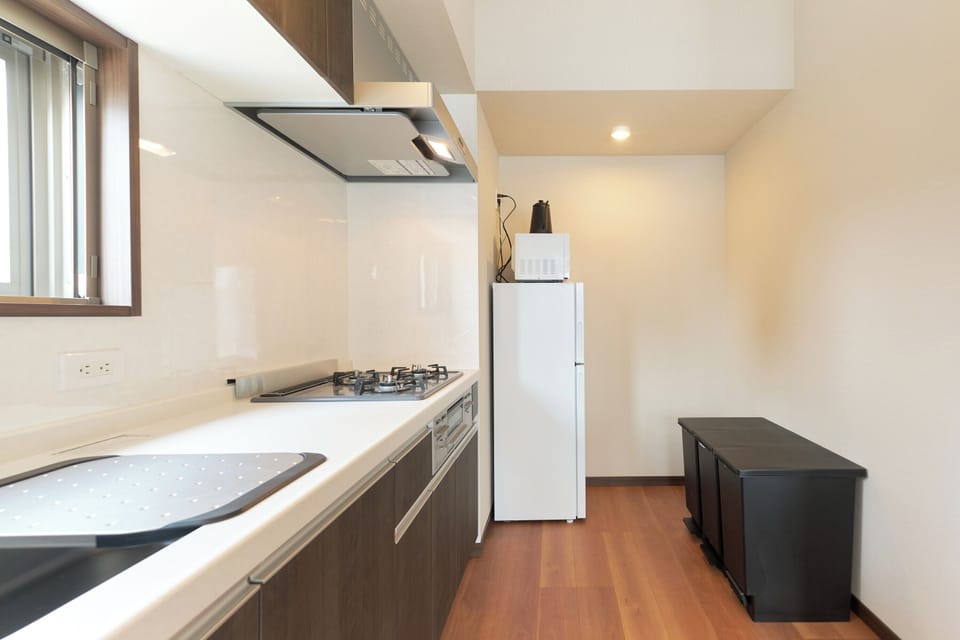 Apartment | Private kitchen | Fridge, microwave, stovetop, cookware/dishes/utensils