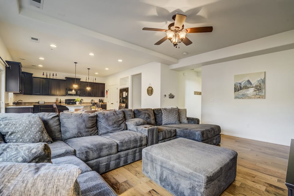 Featuring an open-concept living, dining, and kitchen space filled with natural light.