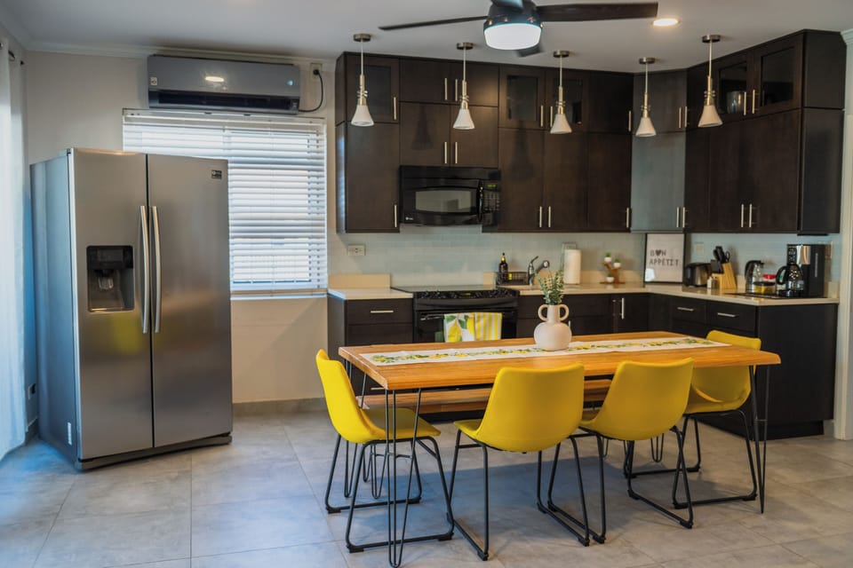 Open concept Kitchen, stocked with all required essentials and glassware 