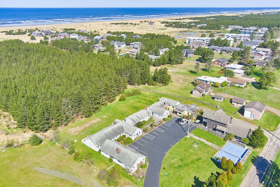 Aerial view highlighting the cottage’s close proximity to the beach—just a short stroll away!