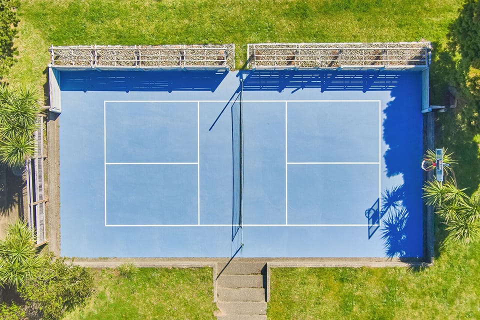 Pickleball court and basketball hoop— perfect for friendly matches and family fun.