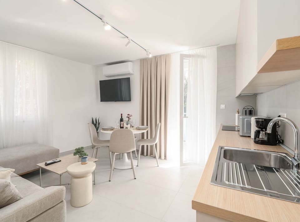 Apartment (Modern City Escape) | Living room | 32-inch flat-screen TV with cable channels