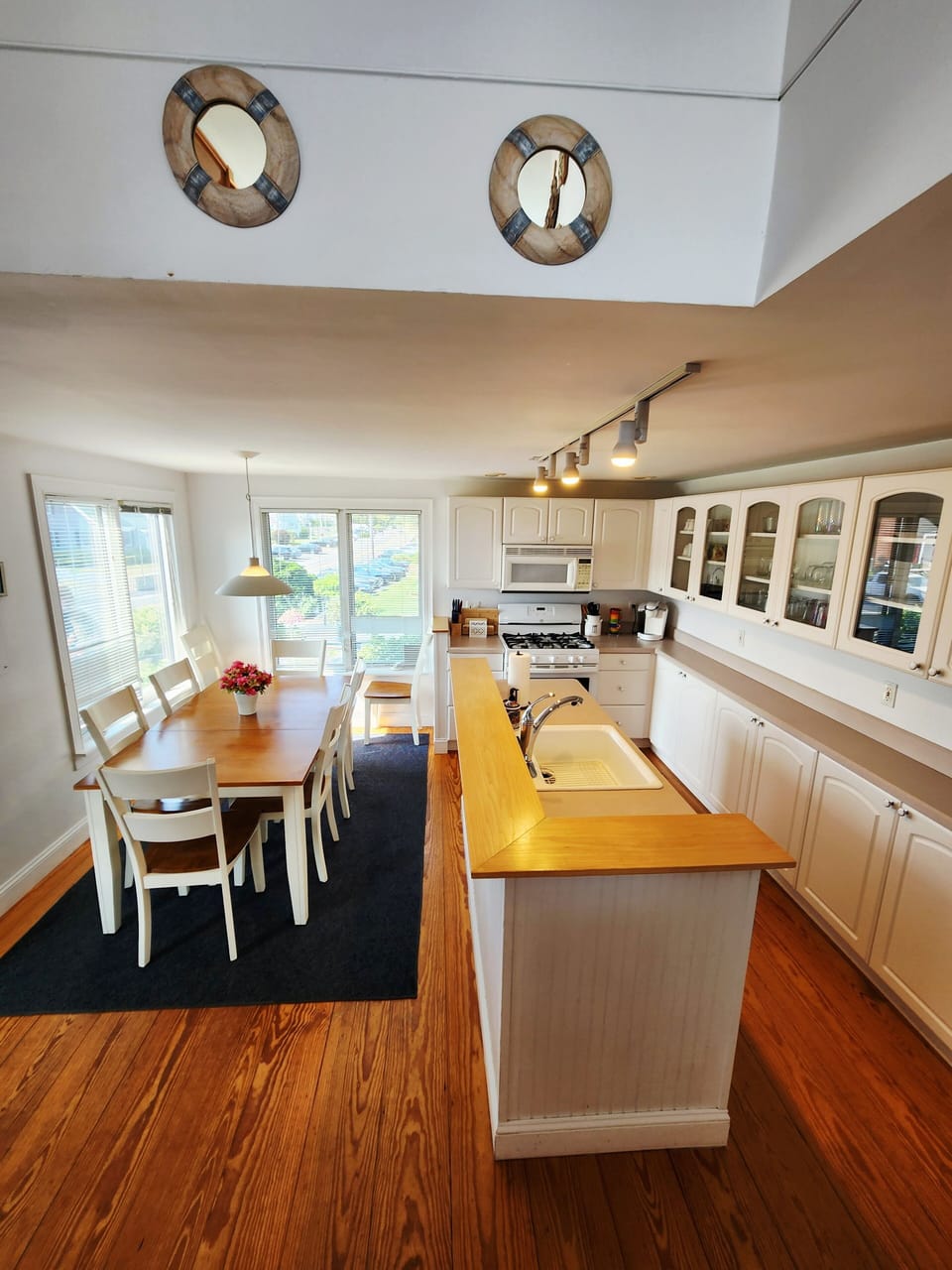 View from stairs up to living area, looking down to kitchen