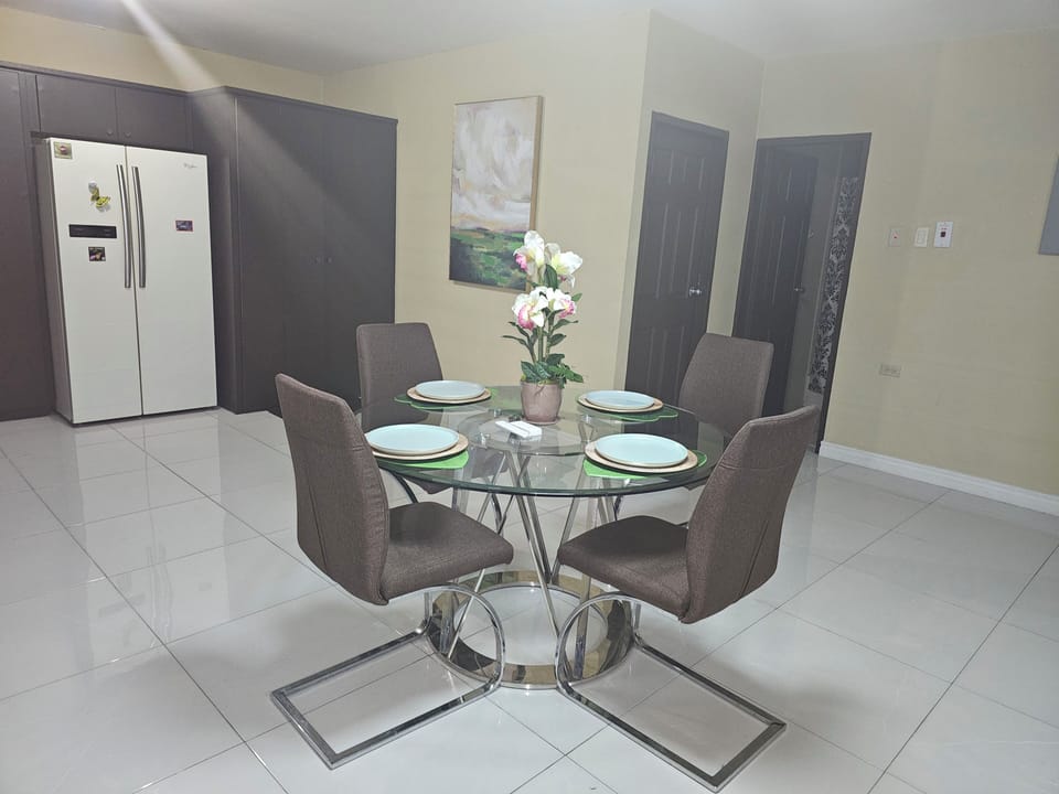 indoor dining, dining table, refrigerator